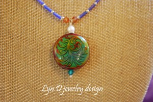 Color changing 'mirage' bead with Swarovski crystals, pearls and Toho seed beads